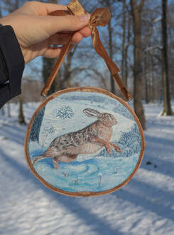 European hare in winter scenery. Acrylic on wood slice 16x14 cm